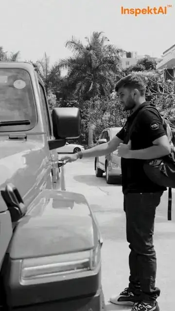 An InspektAI inspector checking a car